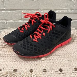 Nike, black and neon pink Free TR sneakers